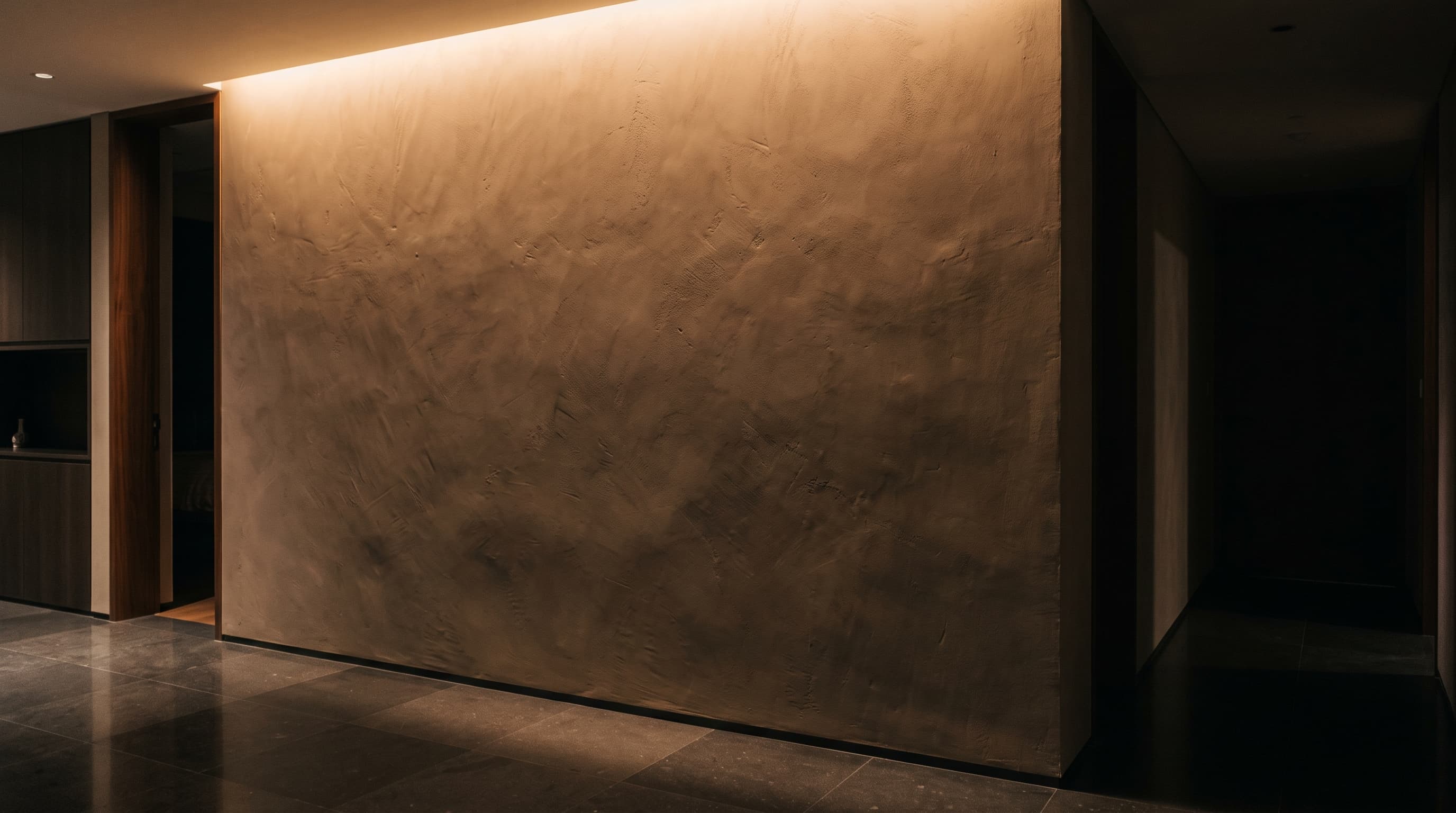 Warm plaster wall in a modern home at night
